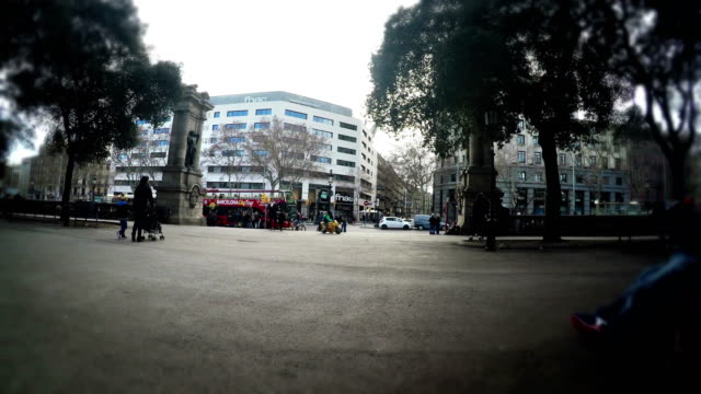 Tourist-pov-sitting-on-bench-on-Plaza-Catalunya