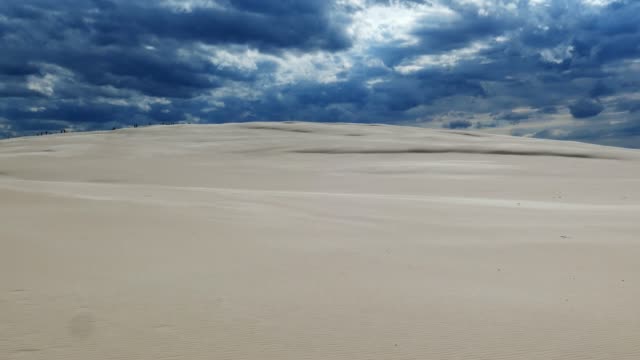 Sandy-Desert-and-Dark-Storm-Clouds