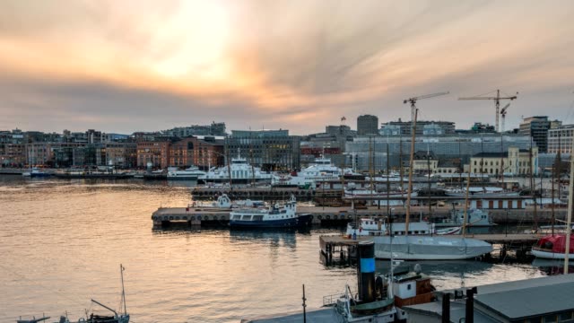 Oslo-city-skyline-day-to-night-sunset-timelapse-at-Oslo-Harbour,-Oslo-Norway-4K-Time-Lapse