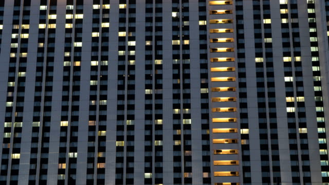 Illuminated-windows-of-hotel-,-time-lapse