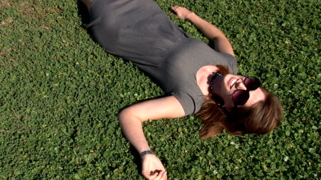 Young-beautiful-woman-laying-in-clover.