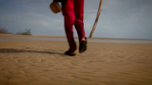 Man-walking-by-the-beach