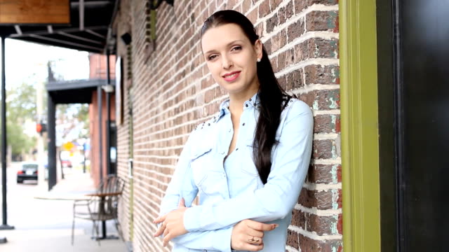 Young-entrepreneur-businesswoman-smiling-outside-her-business