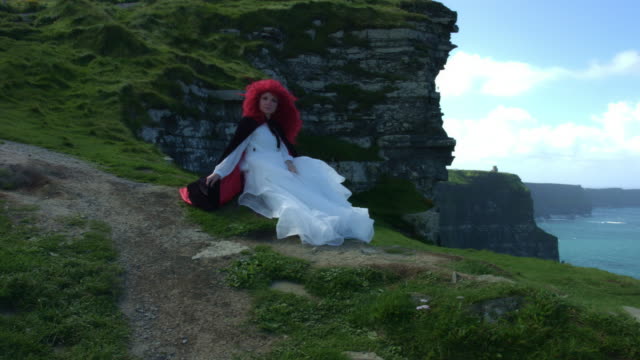 4k-Shot-of-a-Redhead-princess-on-Cliffs-of-Moher-View-in-Ireland