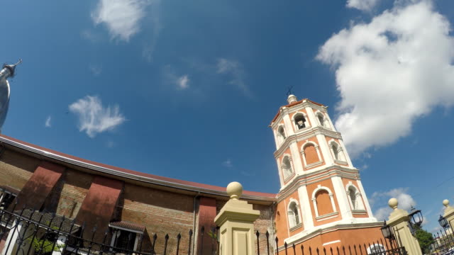 Colonial-16th-century-Spanish-built-of-Saint-Paul-the-First-Hermit-Cathedral-also-known-as-San-Pablo-Cathedral,-showing-her-bell-tower.-tracking-shot