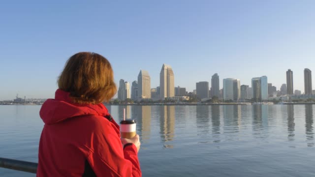 Woman-drinking-coffe-at-morning-on-San-Diego-City