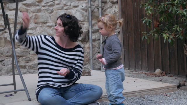 Mother-and-Toddler-Interacting-Outdoors