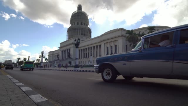 Old-classic-American-cars-on-the-street-of-Havana-city,-Cuba
