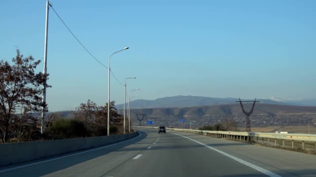 Driving-car-on-highway-in-Georgia.-Transportation.
