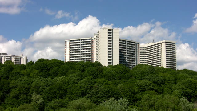 White-apartments-with-green-trees.