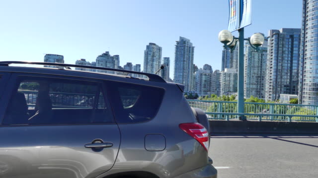 Car-moving-Vancouver-BC-summer-sunny-day