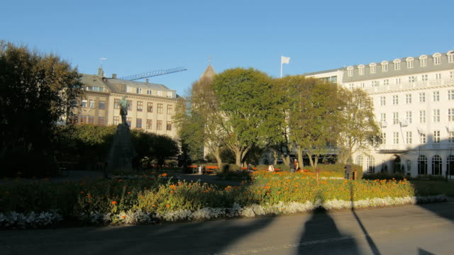 Reykjavik,-Iceland---SEP,-2016:-square-in-from-of-building-of-parliament-with-flowerbeds,-building
