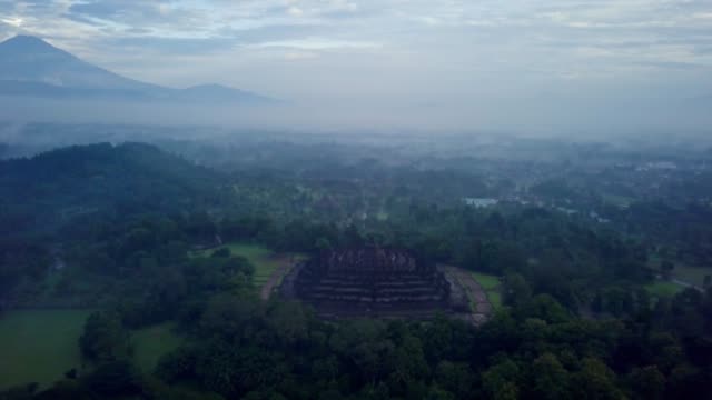 Aerial-view-drone-shot-of-Borobudur-temple-in-Java-at-sunrise,-Indonesia-Travel-religion-drone-concept-4K-resolution