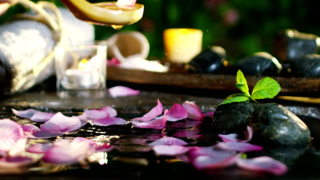 beautiful-water-and-candles-spa-and-wellness-composition-shoot-in-extreme-slow-motion.concept-of-relax-and-meditation.water
