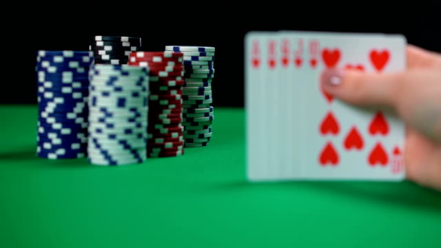 Poker-jackpot-winner,-player-holding-royal-flush,-lucky-cards,-successful-game