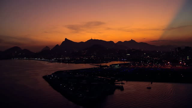Flying-low-angle-aerial-view-of-Rio-de-Janeiro-at-Dusk,-Brazil