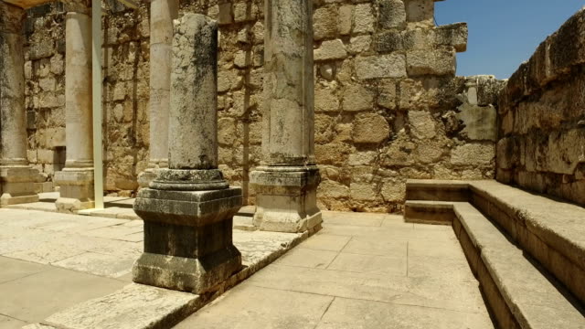 Walking-Behind-Old-Columns-in-Synagogue-in-Israel