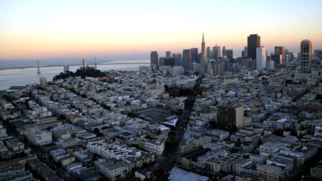 Aerial-sunset-city-Skyscrapers-Wharf-area-San-Francisco