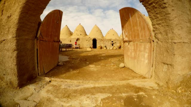 a-wooden-gate-and-a-courtyard-in-a-clay-Arab-village,-near-the-border-between-Turkey-and-Syria