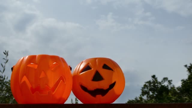 Cloudy-sky-above-halloween-pumpkins