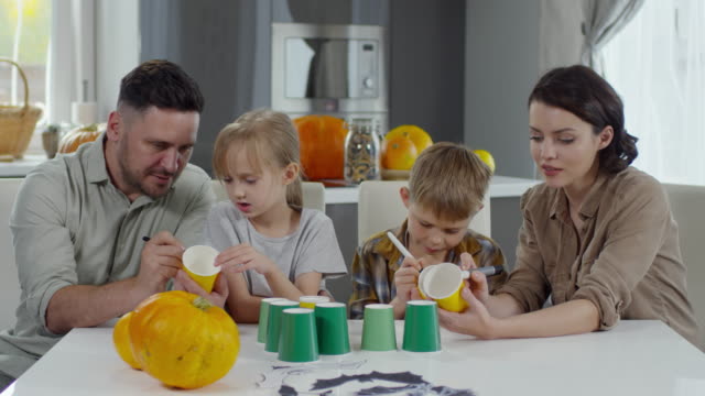 Family-Drawing-on-Halloween-Cups