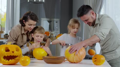 Parents-and-Children-Carving-Halloween-Pumpkins