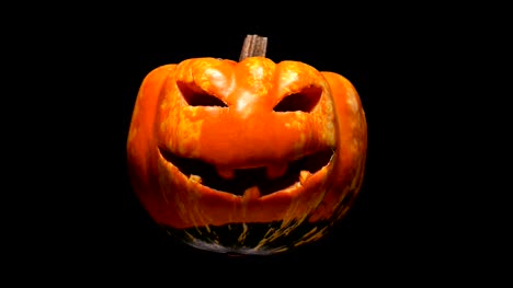 horrible-and-terrible-burning-pumpkin-with-cut-out-eyes