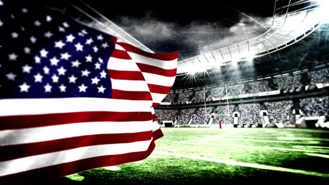 Bandera-estadounidense-soplando-en-estadio-de-fútbol-americano
