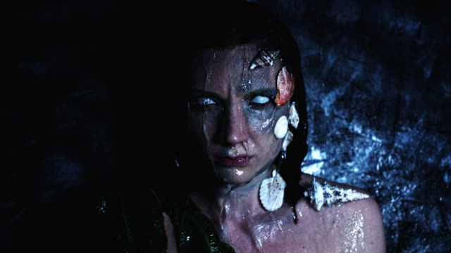 4k-Halloween-Shot-of-a-Horror-Woman-Mermaid-and-Water-Pouring-on-her-Head
