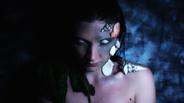 4k-Halloween-Shot-of-a-Horror-Woman-Mermaid-Posing-Nude-with-White-Eyes