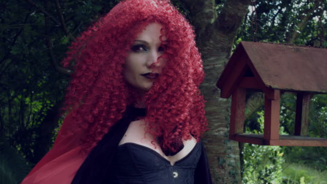 4k-Halloween-Shot-of-Red-Riding-Hood-Posing-and-Turning-from-camera