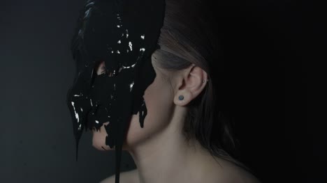 4k-shoot-of-a-horror-Halloween-model---Black-mud-pouring-on-woman's-face