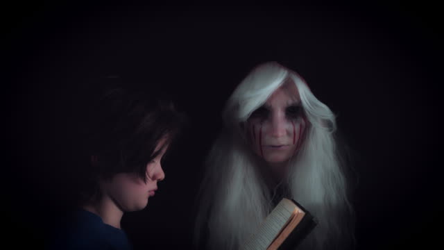 4K-Horror-Witch-Appears-from-dark-and-Child-Reading-Story-Book