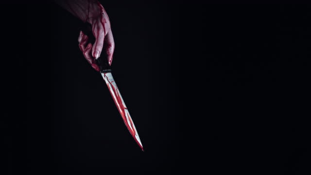 4K-Horror-Creepy-Woman-Hand-with-Knife-Bleeding