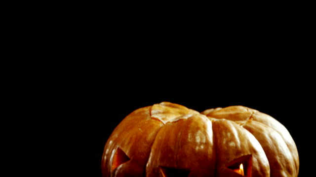 Halloween-pumpkin-against-black-background-4k