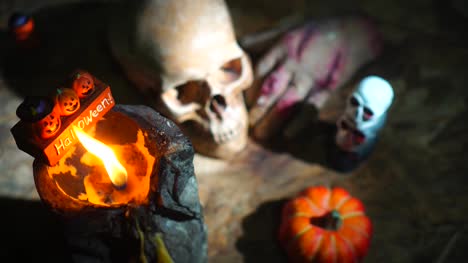 Halloween-day-footage-with-skull,-pumpkin,-candle-light,-and-movement