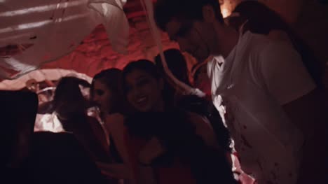 Young-friends-dancing-and-flirting-at-Halloween-party