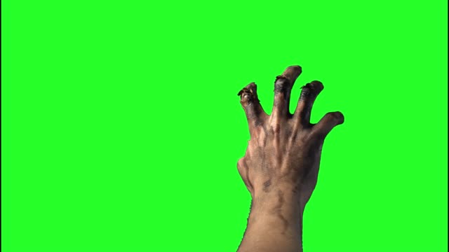 zombie-hand-on-a-green-background-on-Halloween