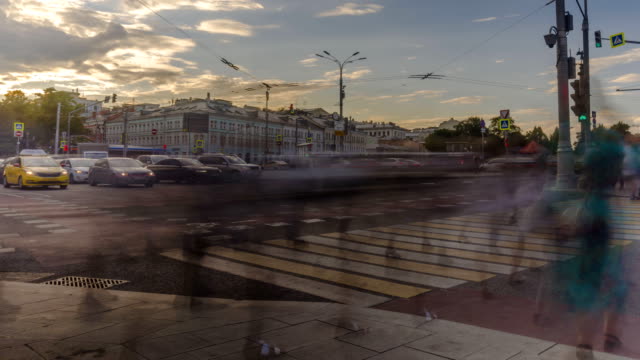 view-of-urban--square-with-the-movement-of-public-transport,-cars-and-crowds-of-people-rushed-home-after-the-working-day,-time-lapse