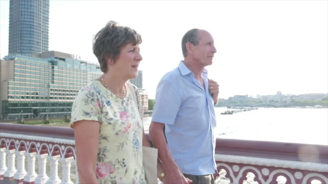 Active-senior-couple-walking-in-london