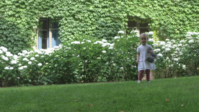 Child-Running-in-Lush-Backyard