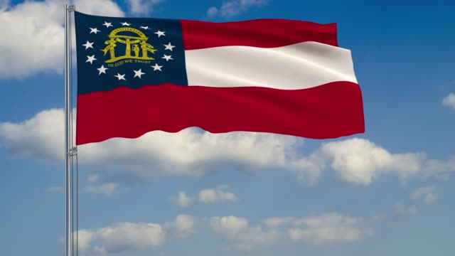 Bandera-del-estado-de-Georgia-en-el-viento-contra-el-cielo-nublado