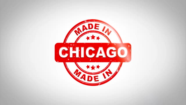 Made-In-CHICAGO-unterzeichnet-Stanz-hölzernen-Stempel-Textanimation.-Roter-Tinte-auf-Clean-White-Paper-Oberfläche-Hintergrund-mit-grünen-matten-Hintergrund-enthalten.