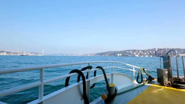 Vessel-sailing-on-sea-towards-healthcare-resort-on-horizon,-tourist-transport