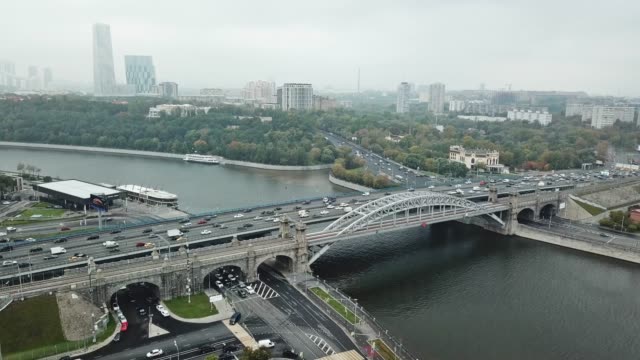 Aerial-view-of-traffic-on-a-car-and-train-bridge-in-big-city