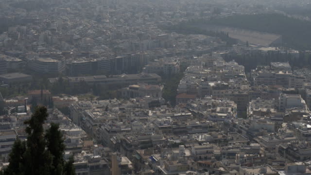Vista-aérea-de-los-tejados-y-casas-en-Atenas,-Grecia.