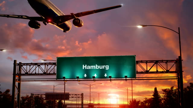 Airplane-Landing-Hamburg-during-a-wonderful-sunrise