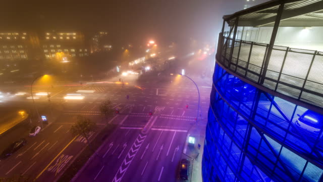 Foggy-crossroad-with-colerfull-light-by-night---DSLR-timelapse