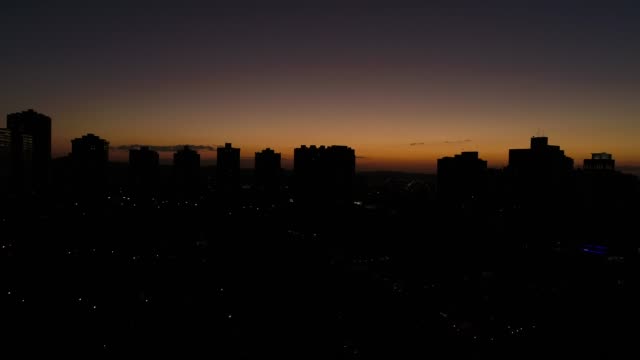 Sunset-behind-City-Skyline---Silhouettes