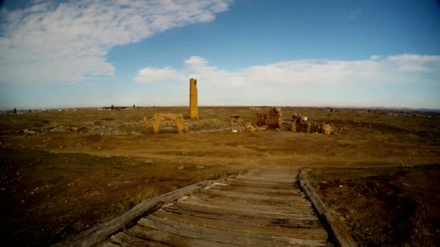 a-wooden-road-to-the-ruins-Date-Harran-University-on-the-outskirts-of-an-ancient-Arab-city-in-southern-Turkey